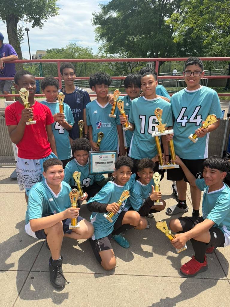 The Boys Soccer Team with their 1st Place trophies