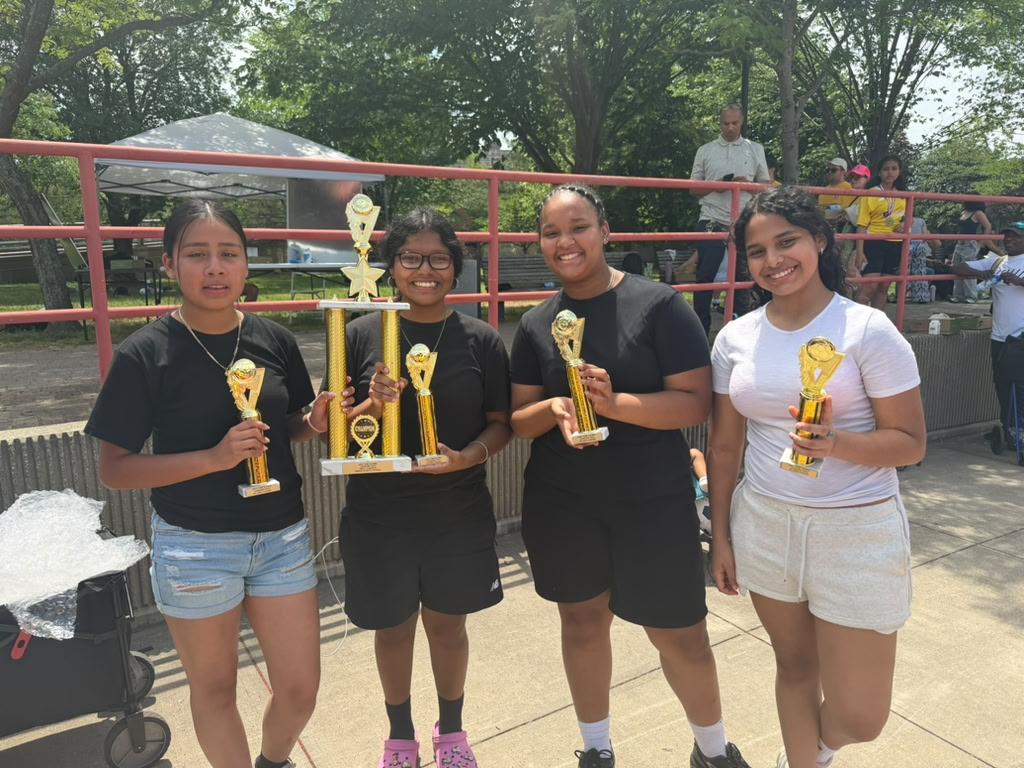 Members of our championship-winning Girls Soccer Team proudly displaying their 1st Place trophies